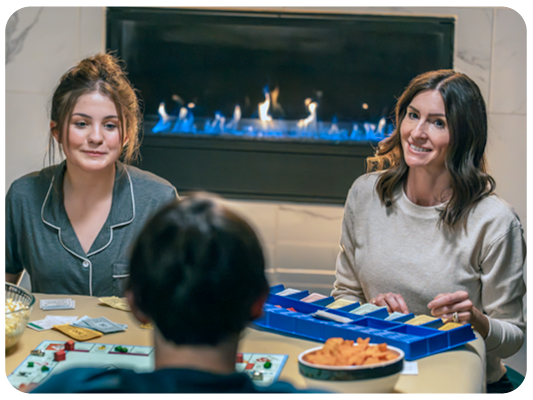 Family sitting by the fireplace