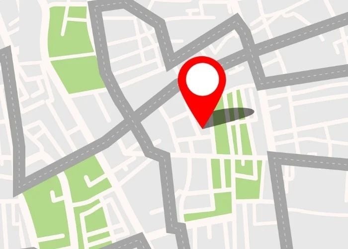 A location is pinned on an animated street map