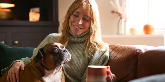 woman and dog cozy and warm